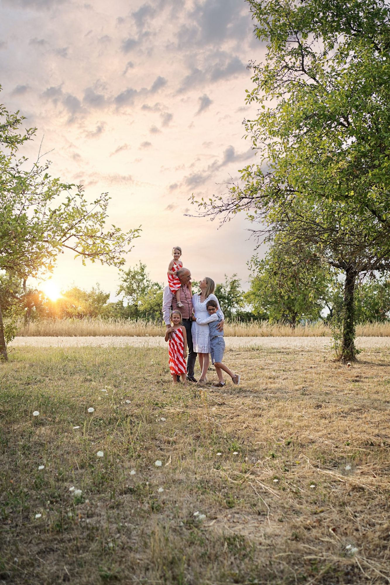 Familienbilder im Sonnenuntergang